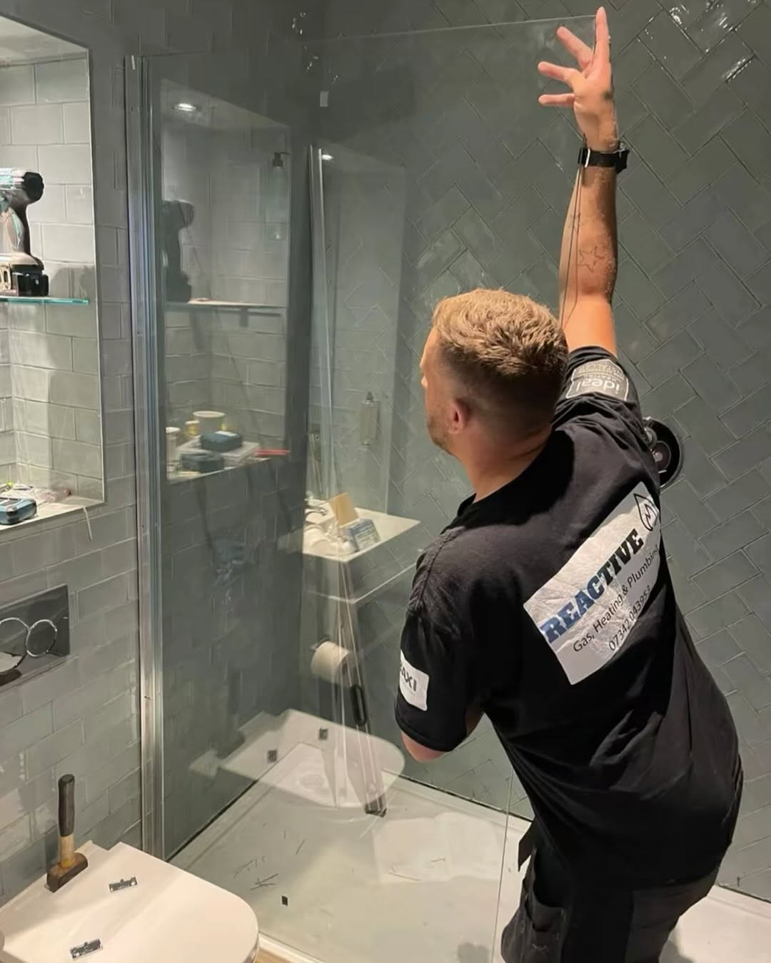 Reactive engineer installing a shower in a Leicestershire bathroom