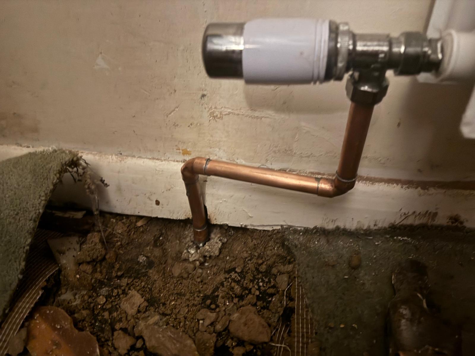 New copper pipework and TRV valve replacement beneath lifted floorboards