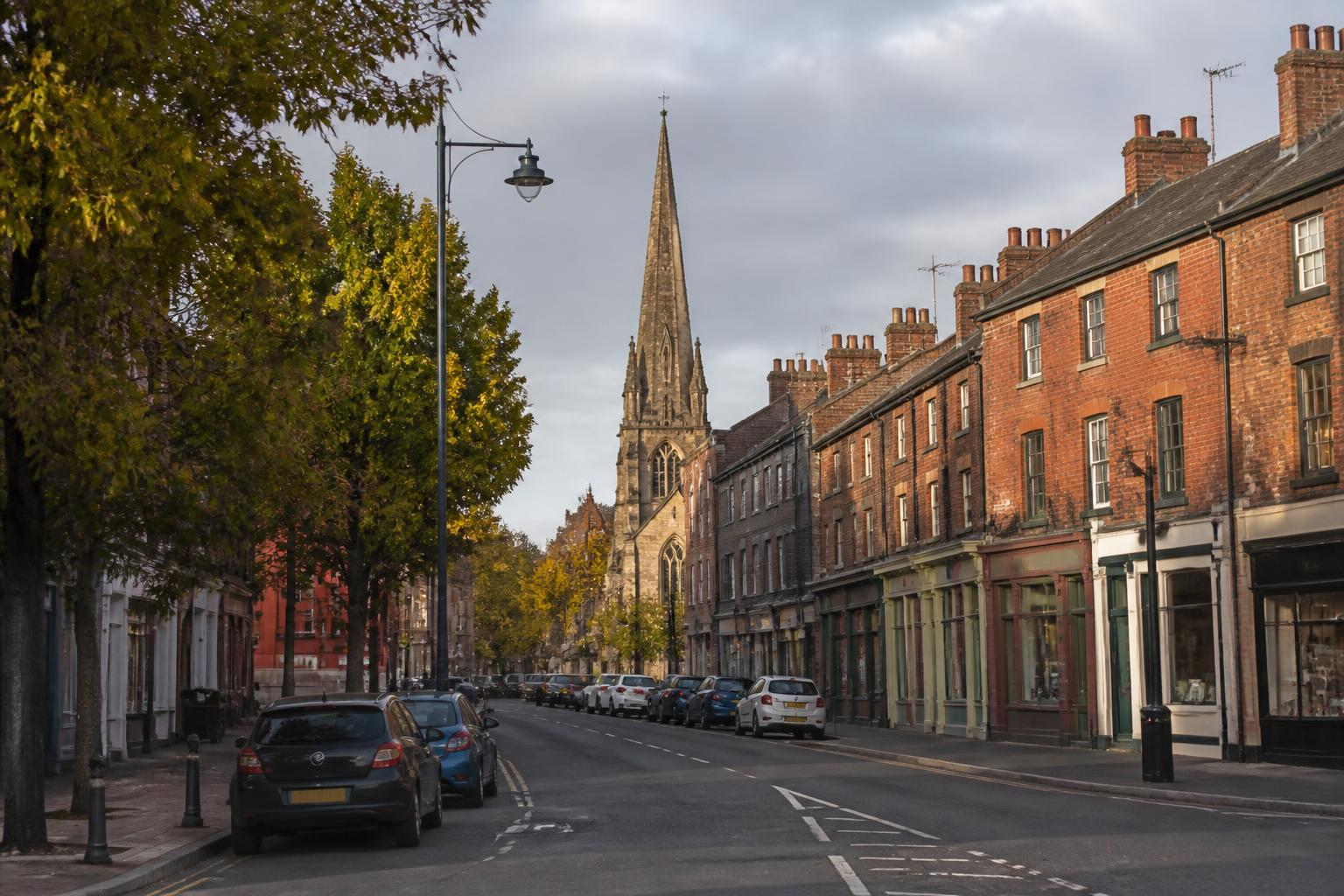Shepshed market town high street with St Botolph's spire and Victorian terraces
